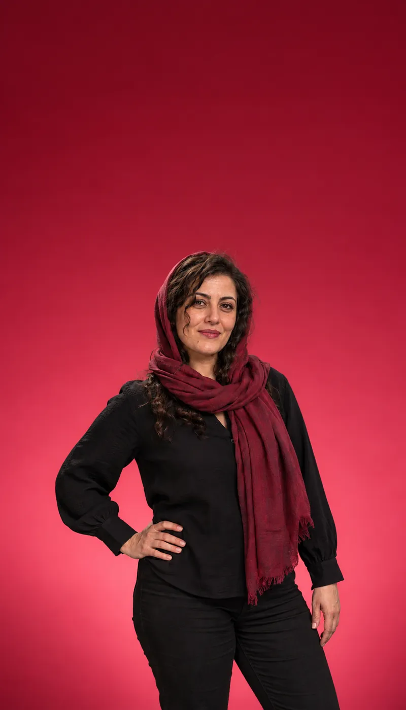 Woman in a burgundy scarf and black blouse