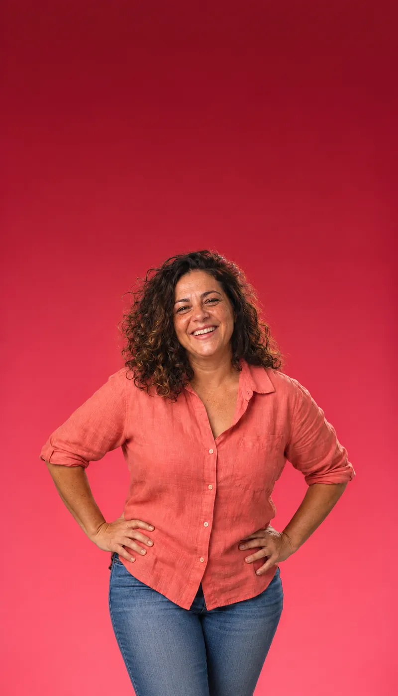 Laughing woman with curly hair in a coral shirt